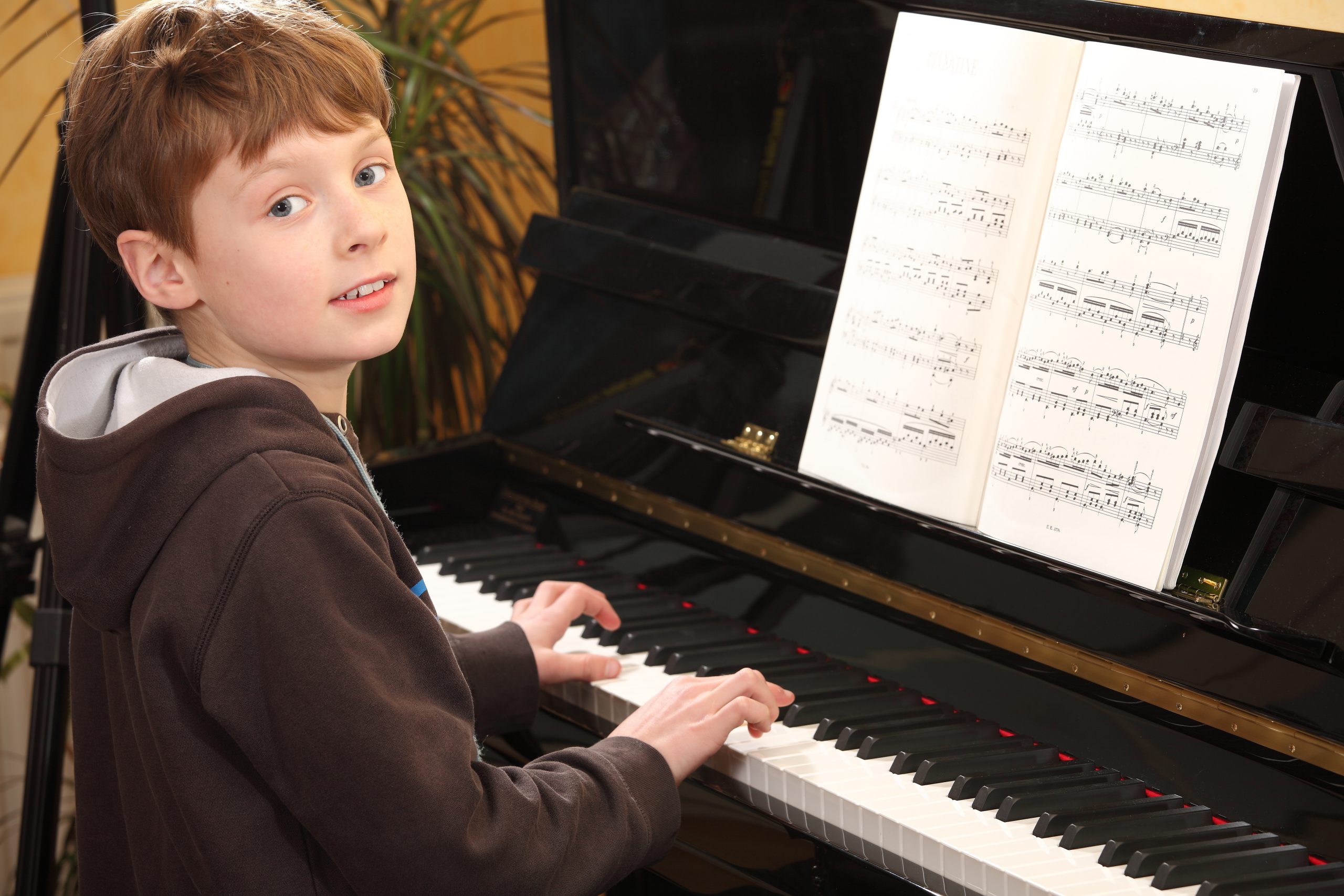 a-boy-playing-a-piano